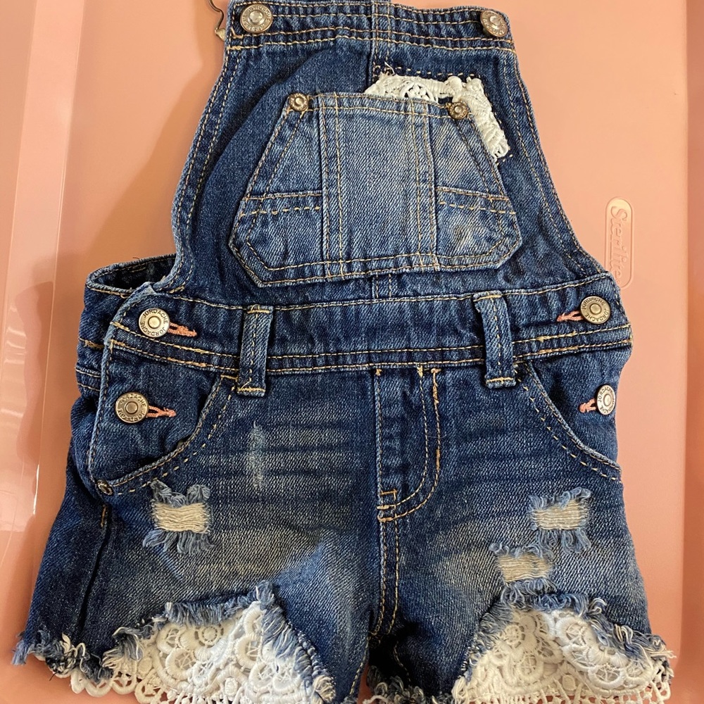 Shorts over alls